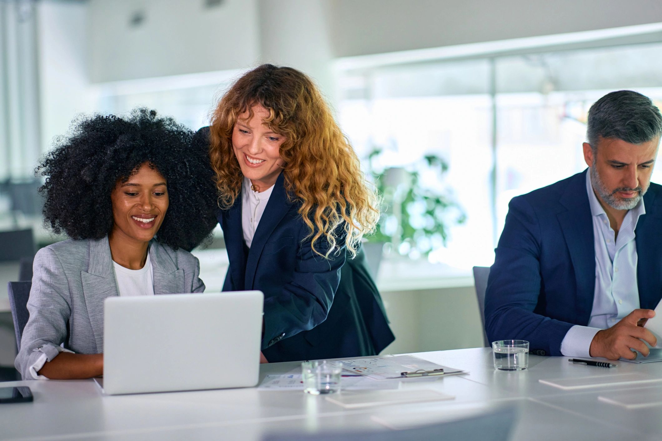 Colleagues collaborating during an executive workshop