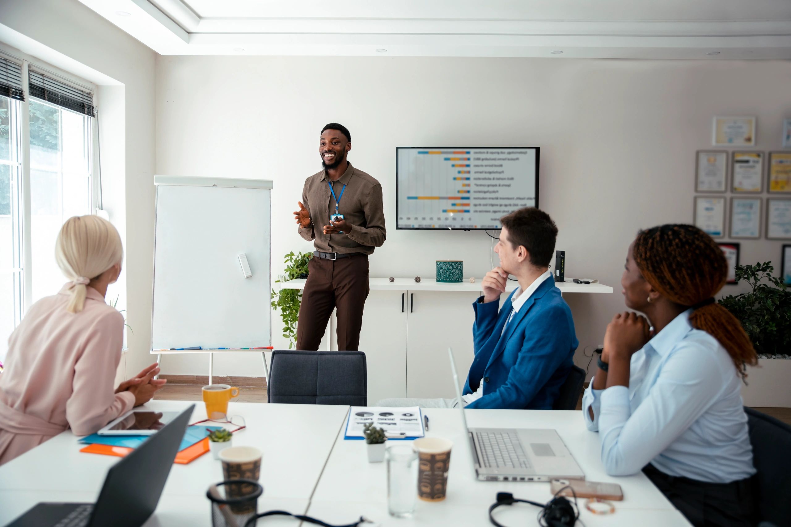Facilitator mentoring and presenting at work