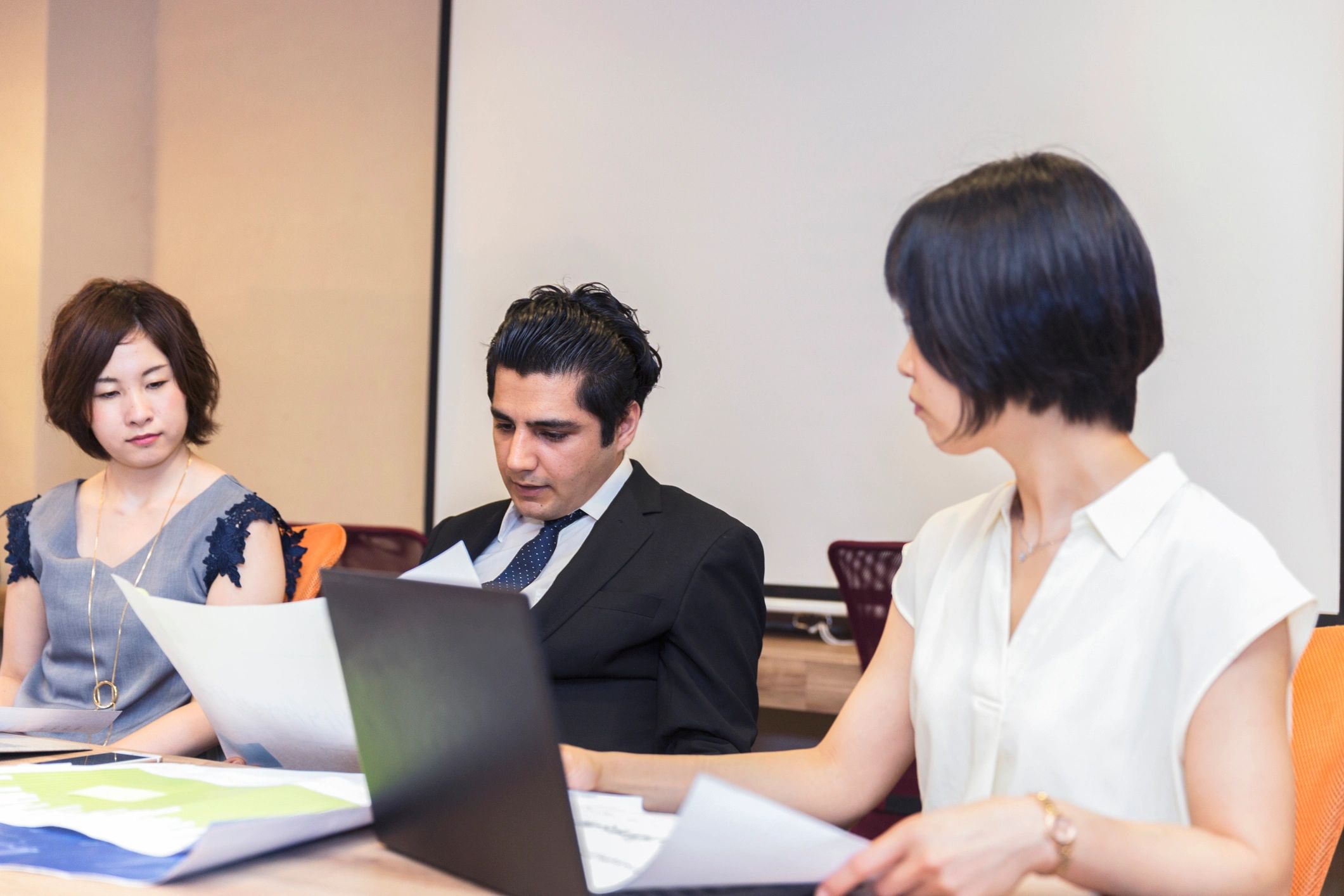 Professional leader reviewing workshop notes